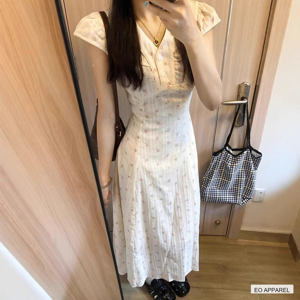 Women's White Floral V-Neck Maxi Dress with Flutter Sleeves — Real-life product view