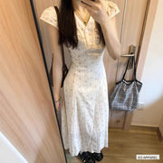 Women's White Floral V-Neck Maxi Dress with Flutter Sleeves — Real-life product view